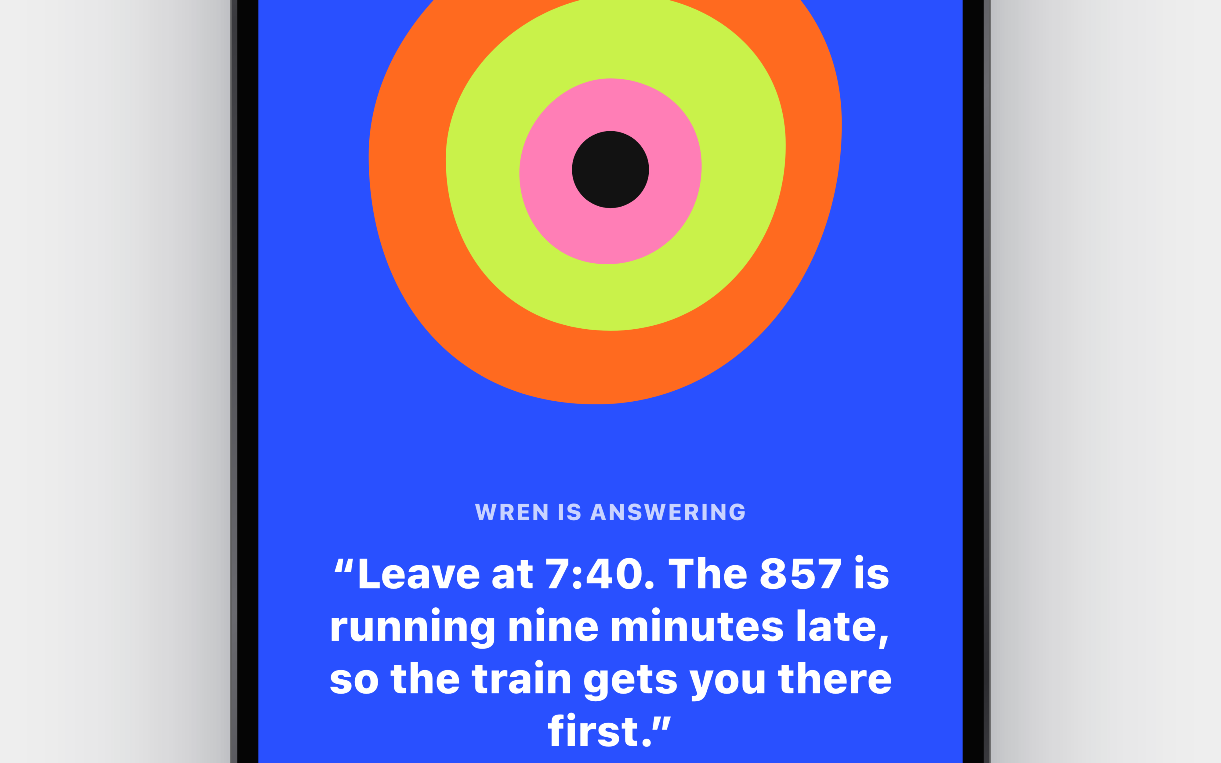 Close-up of the Wren voice mode: the concentric poster-colour blob and the live transcript on cobalt